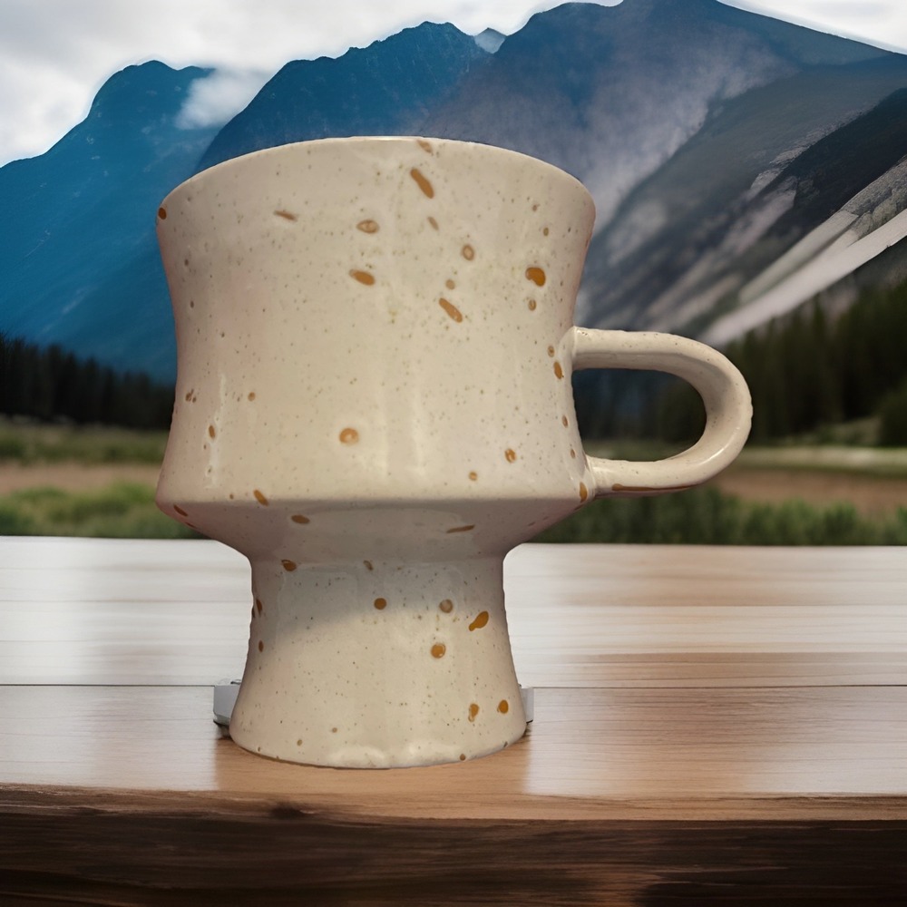 Artisan Speckled ceramic pedestal mug, elongated handle, irregular shape cup‎